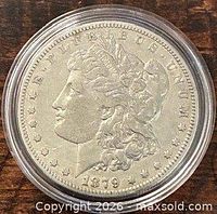 Obverse of 1879 Morgan dollar in capsule