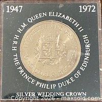 Front of cased coin showing reverse design and surrounding text