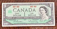 Obverse of 1967 Canadian one-dollar note showing Queen Elizabeth II portrait and commemorative text