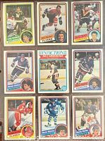 Nine 1982-83 O-Pee-Chee hockey cards in binder page
