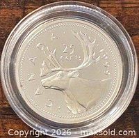 Reverse side showing caribou and 25 cents legend