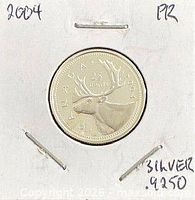Reverse side showing caribou design and date 2004