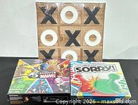 All three sealed games: wooden tic tac toe, 5-Minute Marvel, Sorry!