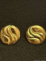 front view showing abstract swirl design on both earrings