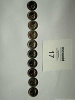 Ten 1967 Canadian 5-cent coins lined vertically, full lot
