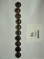 Ten 1967 Canadian Centennial rabbit reverse 5-cent coins lined vertically