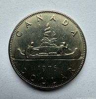 Reverse side showing CANADA DOLLAR 1976 with Voyageur canoe design