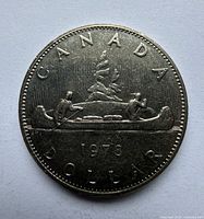 Obverse side with Voyageur canoe design and 1976 date