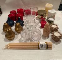 Full assortment of candles and holders laid out