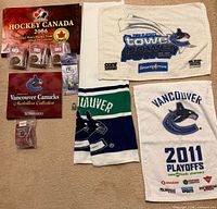 Overview with Hockey Canada pin board, two towels, scarf, small items