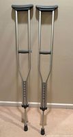 Full view of both crutches standing upright