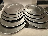 Stack of silver plate chargers