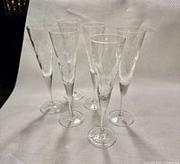 Set of six clear etched Year 2000 champagne flutes