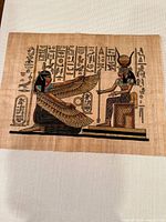 Full view of first papyrus showing winged goddess and seated deity