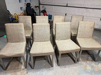 Front view of all eight upholstered dining chairs