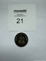 Coin with lot number card