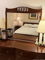 Front view of mahogany framed mirror on dresser