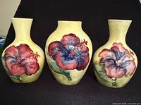 Group shot of three Hibiscus bud vases front view