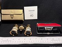 Stella opera glasses, gold case, Sunco folding glasses beside ruler