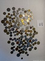 Overview of all coins spread out on white background