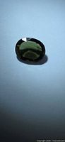 Front view of oval forest green Tourmaline