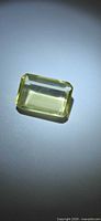 Top view of emerald-cut lemon citrine showing rectangular shape and pale yellow color