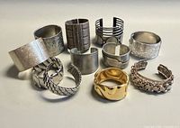 Group of 11 metal cuff bracelets front angle