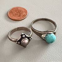 Both rings alongside coin for scale