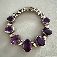 Bracelet formed into circle showing amethysts and clasp