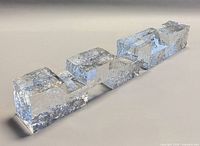 Angled side view of entire glass block sculpture