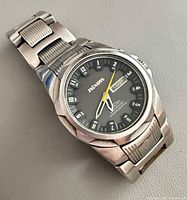 Front view of Nixon The Rover wristwatch showing dial, case and bracelet