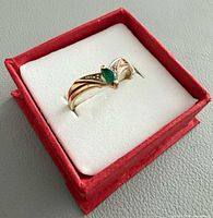 Ring in presentation box displaying overall design and stone