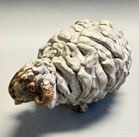 front left view of textured ceramic sheep figurine