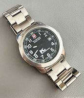 Front view of watch showing full bracelet and dial