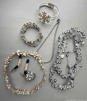All seven jewelry pieces laid out