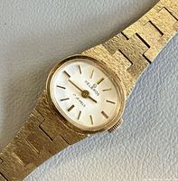 Close view of watch dial and bracelet texture