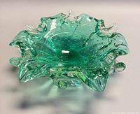 Top angled view showing ruffled rim and controlled bubbles