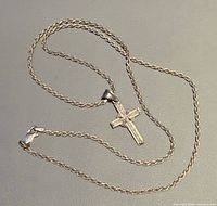 Entire necklace coiled showing chain style, clasp and pendant