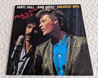 Front album cover with artists’ photo and title