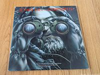 Front sleeve showing binocular artwork and title