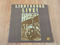 Front cover showing title, band photo, label logo