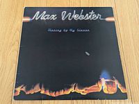 Front album jacket showing title graphics and flame artwork