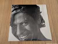 Front jacket view showing portrait cover art and shrink wrap