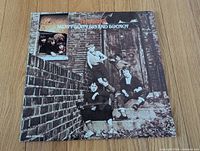 Front cover of LP showing band photograph and title