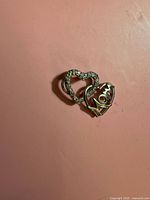 Front view of sterling silver double-heart "Mom" charm