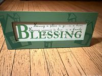 Full front view of plaque showing design and quote