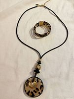 Necklace with pendant and matching bracelet overview
