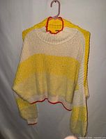 Front view of sweater showing color pattern and shape