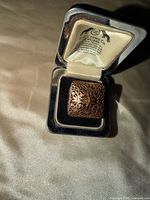 Ring in open presentation box, showing top detail