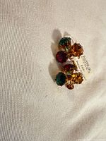Front view of both clip-on earrings with multicolour crystals